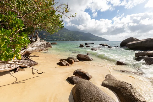 Granite rocks and shallow water at Beau Vallon beach on Mahé
