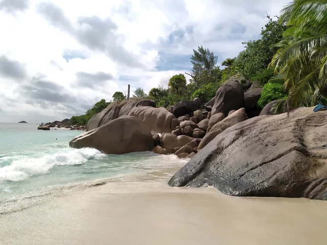Granite boulders and surf at Anse Lazio beach on Praslin